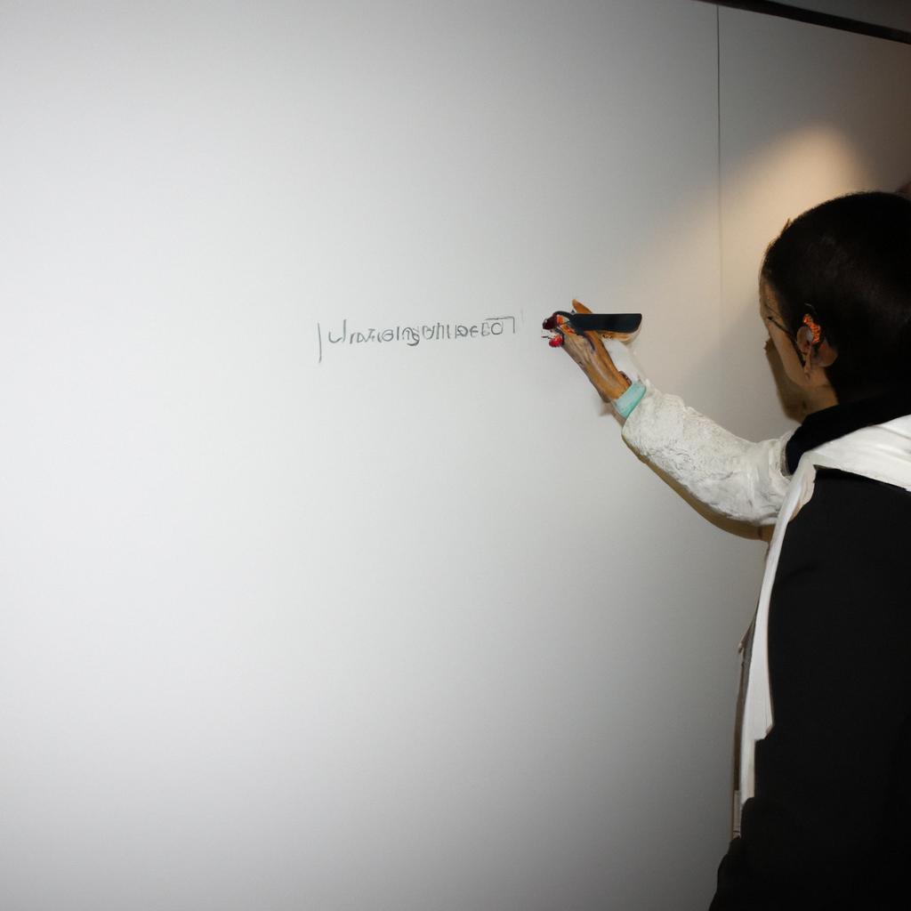 Person writing on a whiteboard